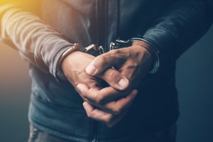 Man in Cuffs with Arms in Front